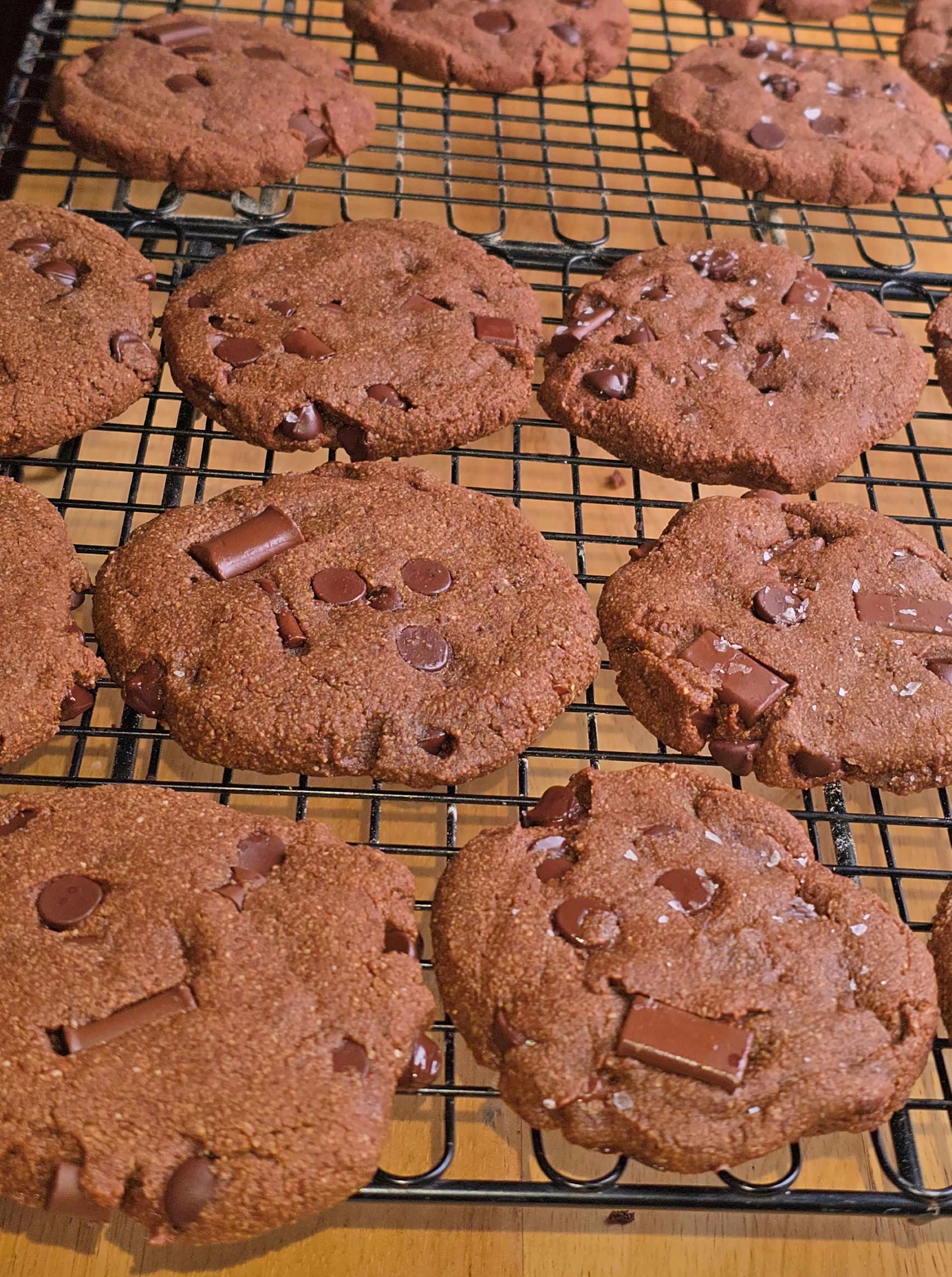 Double Chocolate cookies with chocolate chips on a cooling rack